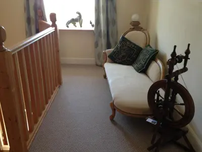 a living room with a chair and a window at Langside in Stirling