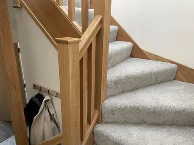 a set of stairs with a wooden stair case at Stunning Apartment in Callander in Callander