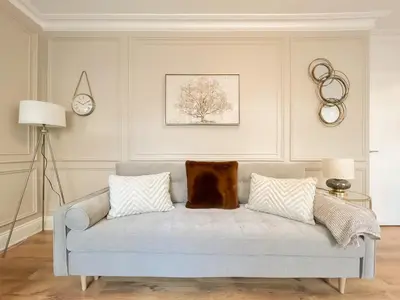 a living room with a couch with a dog sitting on it at Cozy 1 bed Blythswood Apartment in Glasgow