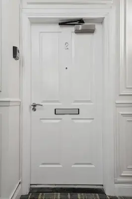 a white door with a handle in a room at (G2) Central 1 Bed Blythswood Flat in Glasgow