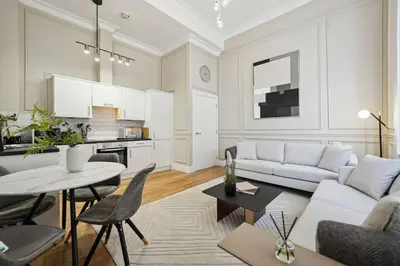 a living room with a couch and a table at (G4) Luxurious 2 Bed Blythswood Flat in Glasgow