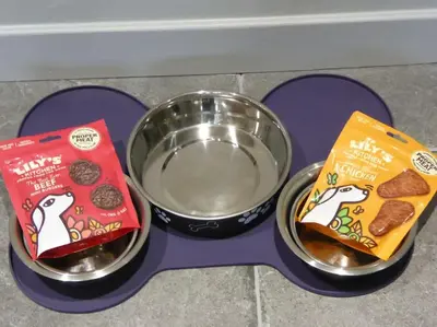 a feeding tray with a bowl of food and a box of cookies at Blackside Cottage - A Luxury Rural Retreat in Mauchline