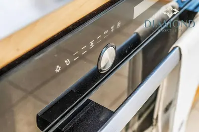 a close up of a microwave oven with a knob at FOUNDRY - 2 Bedrooms, Fully Equipped, Free Parking, WiFi, FAVOURITE for Contractors, Long Stays Welcome, Food, Bars, Shops by Diamond Short Lets in Dunfermline