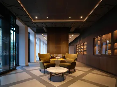 a lobby with chairs and a table in a building at The Resident Edinburgh in Edinburgh