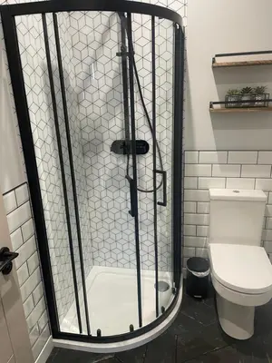 a shower in a bathroom with a toilet at Springlea in Oban