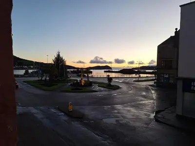 a person is standing in the middle of a street at Ocean View in Campbeltown