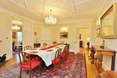 a large dining room with a table and chairs at Elegant 3-Bedroom Ramsay Garden Apartment in Edinburgh City Centre in Edinburgh