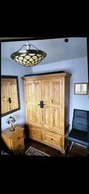 a room with a large wooden cabinet and a lamp at Deluxe Double Bed With Private Mordern Shower & Smart TV in Clydebank