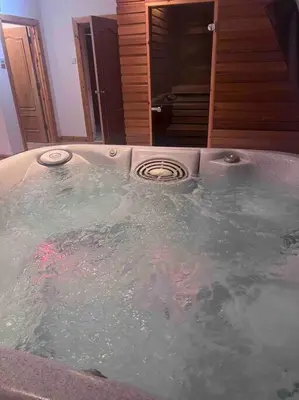 a jacuzzi tub in a bathroom with at Langside apartments in Newhouse
