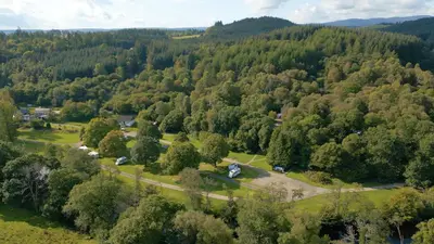 an aerial view of a forest of trees at Cobleland Campsite in Gartmore