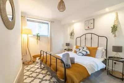 a bedroom with a large bed and a window at Luxury Riverview City Centre Apartment 2 in Glasgow