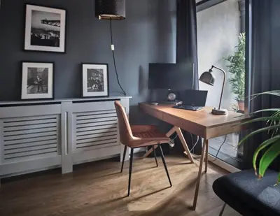 a desk with a laptop and a chair in a room at Glasgow, Finnieston Luxury 2 Bed with parking, e-check in, hi-fi in Glasgow