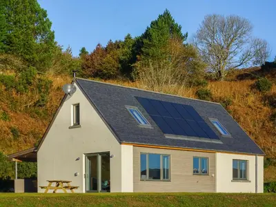a house with solar panels on the roof at Tulamain in Ardfern