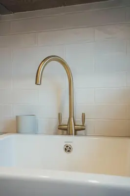 a sink with a faucet in a kitchen at James Street 2 Bedroom Apartment in Stirling