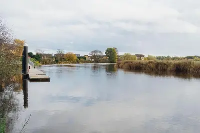 a river with a dock in the middle of it at James Street 2 Bedroom Apartment in Stirling