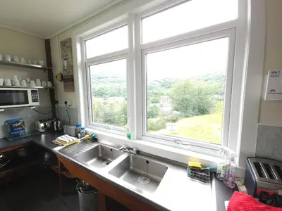 a kitchen with a sink and a window at West Highland Lodge in Kinlochleven