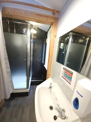 a bathroom with a sink and a shower at West Highland Lodge in Kinlochleven