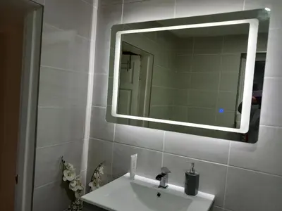 a bathroom with a sink and a mirror on the wall at Couple's Retreat-West Kilbride in Seamill