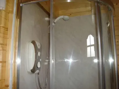a shower with a glass door in a bathroom at Ardchiavaig Cabin in Uisken
