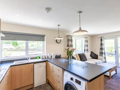 a kitchen and living room with a washer and dryer at 3 Bed in Moffat oc-ca402 in Moffat