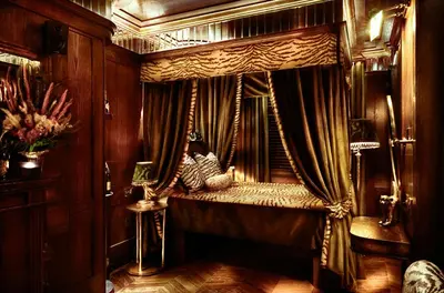 a room with a canopy bed with curtains at House of Gods Glasgow in Glasgow