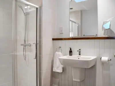 a bathroom with a sink and a shower at The Old Mill in Linlithgow