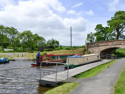 a boat is docked next to a bridge at Pride Of Erin - Uk45929 in Linlithgow