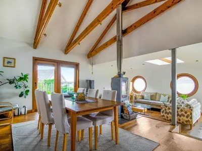 a dining room with a table and chairs at Shore House in Kilcreggan