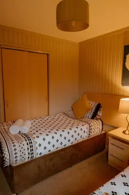 a bedroom with a bed in a room at Whisky Whispers Hunters Quay in Sandbank