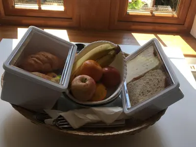 three trays of food in a bowl on a table at Alderdale B&B in Luss