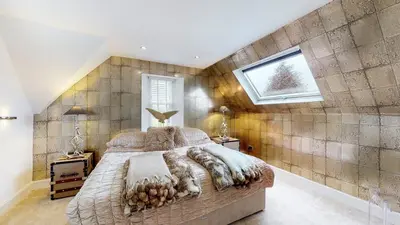 a bedroom with a large bed and a window at Cameron North Lodge in Alexandria