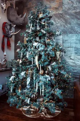 a blue christmas tree with ornaments on it at Cameron North Lodge in Alexandria
