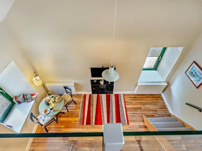 an attic living room with a red and white rug at 1 Bed in Dunning oc-ca333 in Dunning