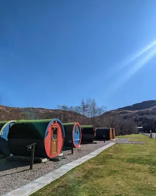 a row of bunks on display in a park at Blackwater Glamping Pods in Kinlochleven