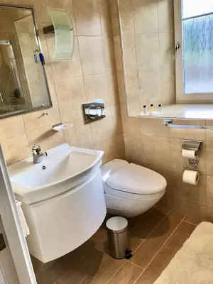 a bathroom with a white toilet and a sink at Bremenvoir Barn in Bunessan
