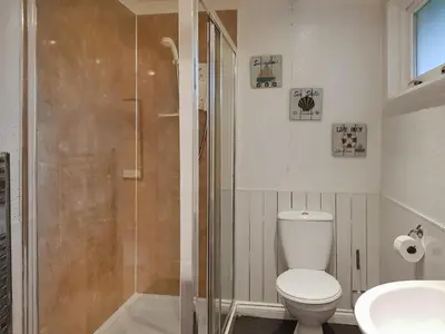 a bathroom with a shower and a toilet and a sink at Leven Lodge 1 - Uk46042 in Balloch