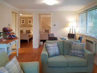 a living room with a couch and a bedroom at Leven Lodge 3 - Uk46045 in Balloch