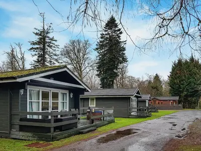 a small house with a garage in front of it at Leven Lodge 3 - Uk46045 in Balloch