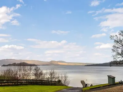 a view of a lake with mountains in the distance at Leven Lodge 2 - Uk46044 in Balloch