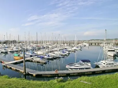 a marina with lots of boats in the water at The Penthouse- The Kingsley Collection in Troon