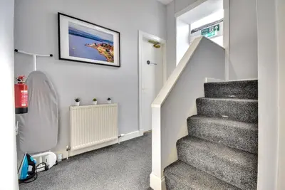 a staircase in a home with a stair case at The Shore in Gourock