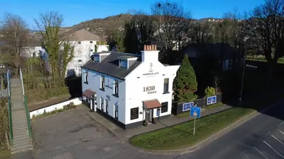 an aerial view of a white house on a street at The Shore in Gourock