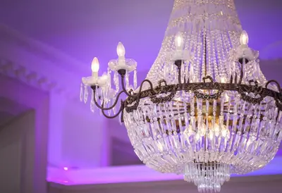 a chandelier with lights in a purple room at Braid Hills Hotel in Edinburgh