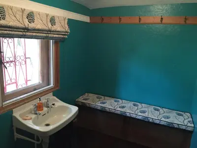 a bathroom with a sink and a window at Moorlands in Helensburgh