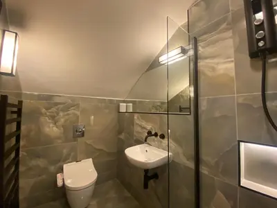a bathroom with a toilet and a sink at Ashton View in Glasgow