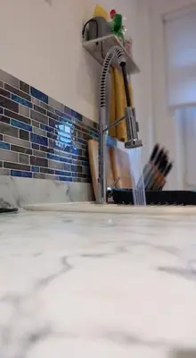 a kitchen sink with a faucet in a kitchen at Springfield Apartment - Train to Glasgow or Edinburgh - Private Parking & Wifi in Airdrie
