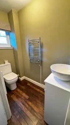 a bathroom with a toilet and a sink at 6 Tobar Oisinn in Oban
