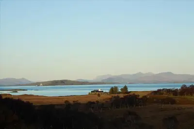 a view of a lake with mountains in the background at Old Ferry House in Auchnacraig