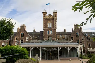 a large brick building with a flag on top of it at Crieff Hydro in Crieff