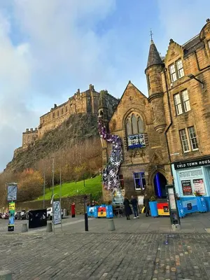 a building with a statue of a giraffe in front of it at E'holidays in Edinburgh